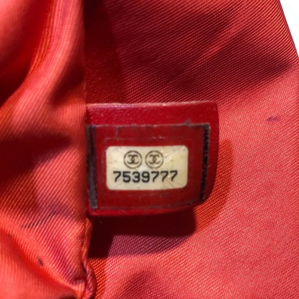 CHANEL Red Quilted Tote Bag with Embossed Logo